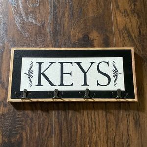 Key holder with a minor chip on the left side. $15